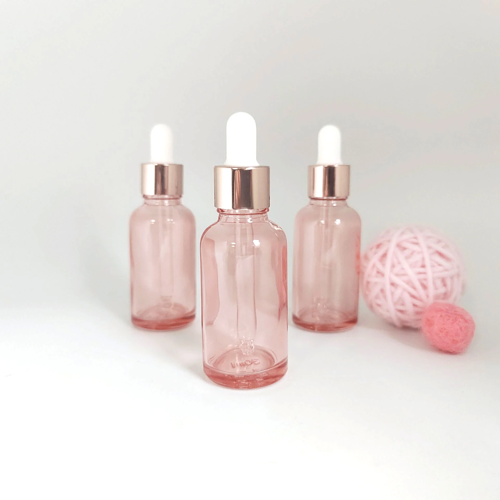 

Ready to ship rose gold glass bottle with dropper for essential oil packaging 5ml 10ml 15ml 20ml 30ml 50ml 100 ml 200ml