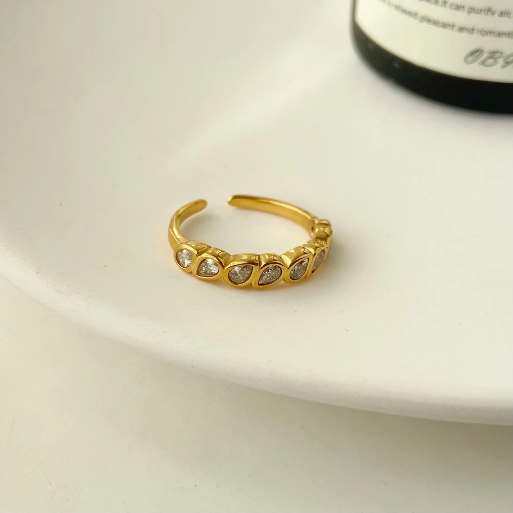 

Hot selling water drop zircon arranged open ring jewelry with fine edged stainless steel plated 18K gold ring