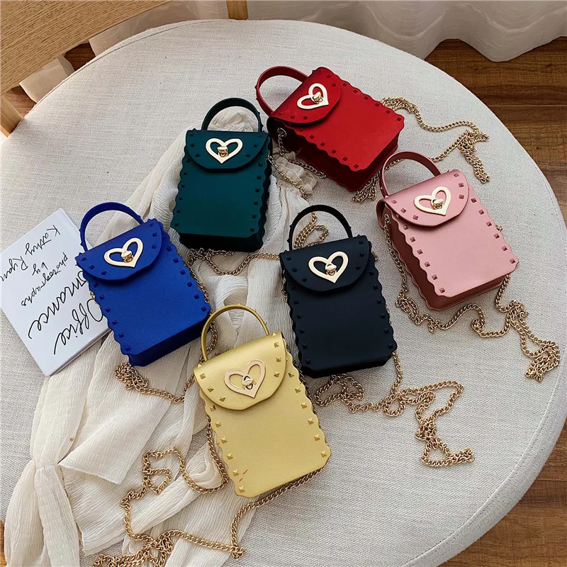 

Wholesale Rivet Kids Handbags Trendy Ladies Mini Heart Shaped Cell Phone Shoulder Bag Pvc Candy Color Jelly Bag