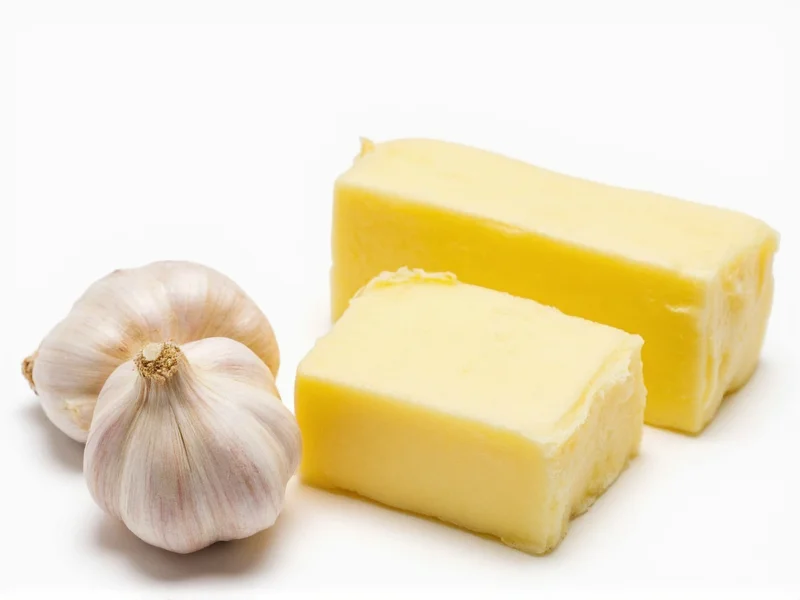 Fresh garlic cloves and butter for homemade garlic bread