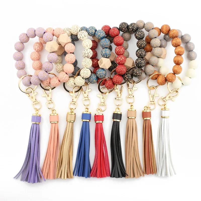 

2022 Hot Sale Mixed Color wooden Leopard Bead Bracelet Tassel Keychain with disc