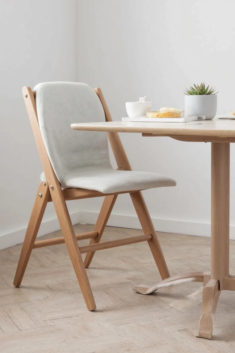 Ikea Hemnes chair with soft grey cushions.