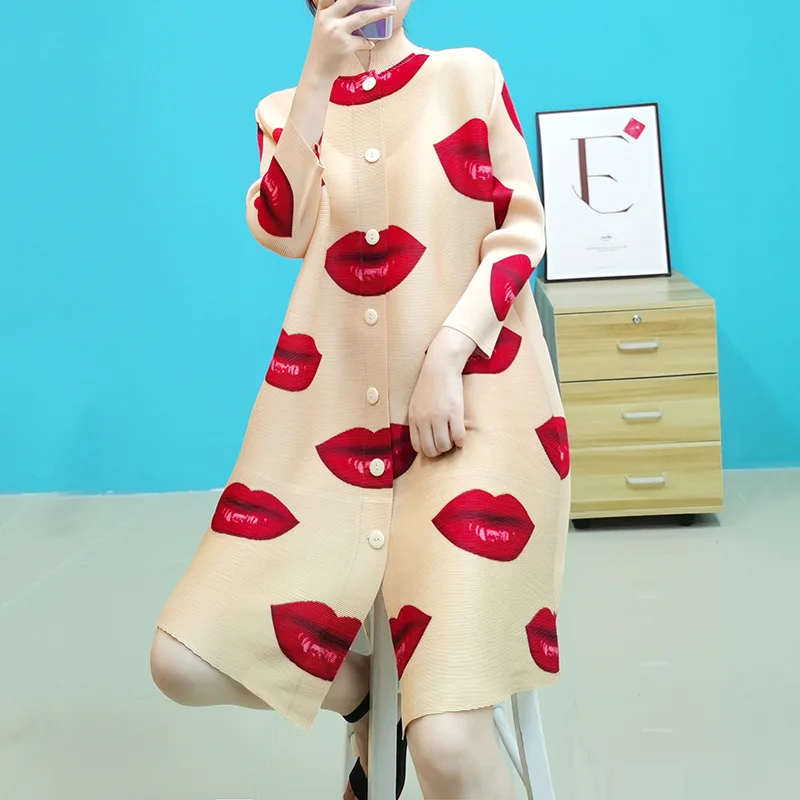 

Issey Miyake's pleated trench coat and red lip coat for fall 2021, Shown