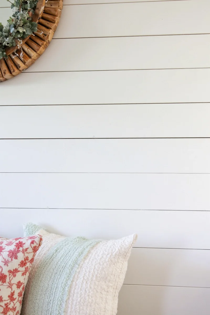 Happy family admiring finished shiplap wall