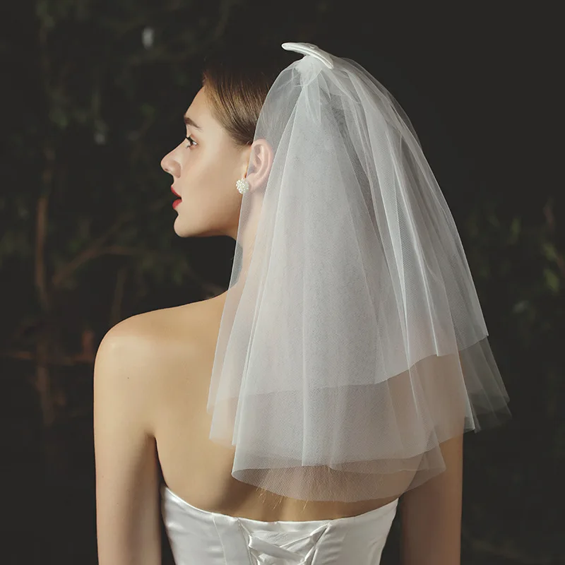 

Jachon The new bridal wedding dress covers the  wedding face with three layers of veil, As picture