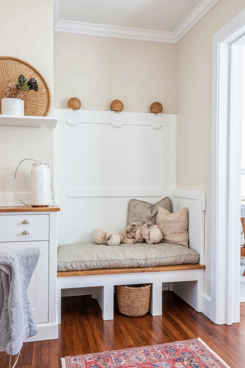 A cozy dog room with custom furniture, paw-print rugs, and stylish storage bins.