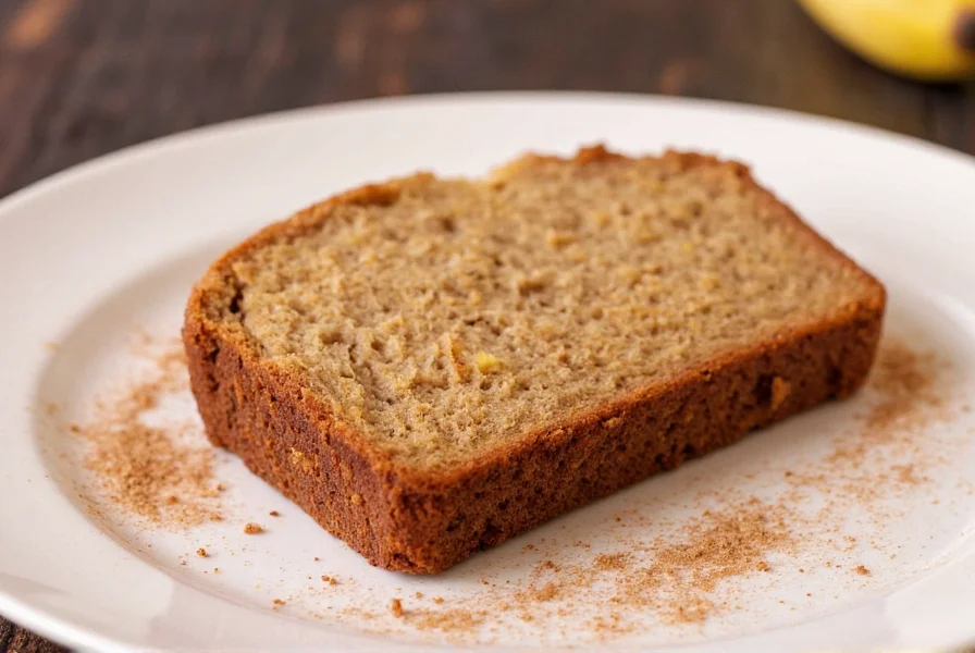 Perfectly baked cinnamon crunch banana bread with golden crust and visible cinnamon streusel topping on a wire rack