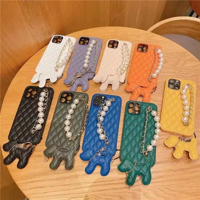 

For iPhone 7 X XR 11 2021 Fashion Luxury Women Pearl Wrist Strap Shockproof Leather Phone Case with Pendant, For iPhone 12 Case, Various