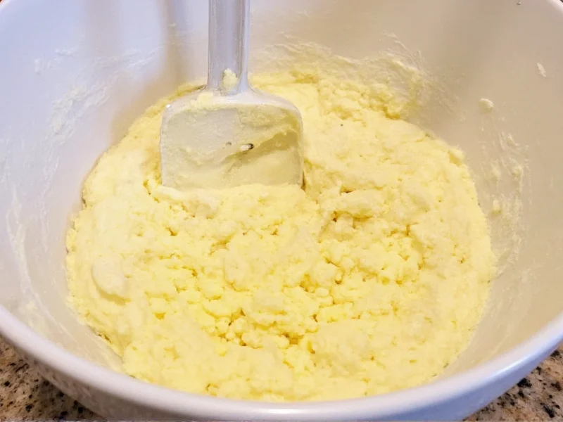 Creaming butter and sugar for sugar cookie dough in a bowl