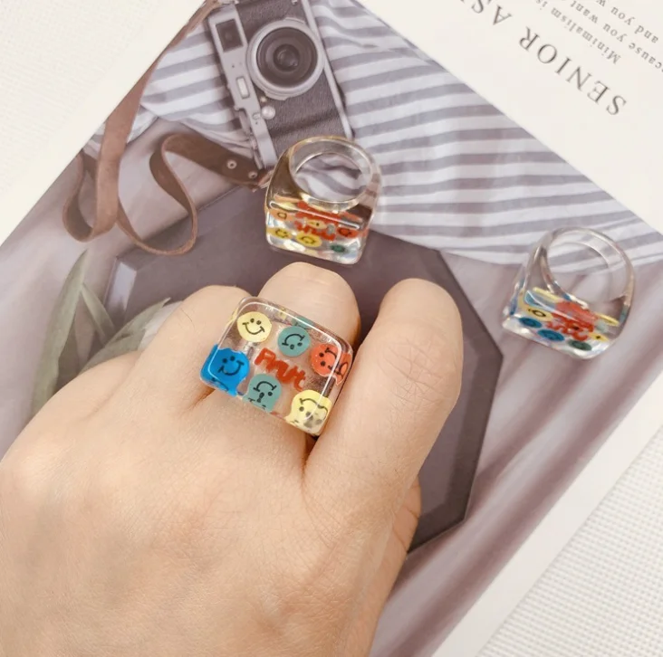 

Cartoon transparent resin smiling face crystal color square ring jewelry wholesale