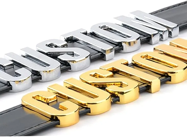 Close-up of black dog collar with CUSTOM gold and silver metal letter charms — personalized letter detail
