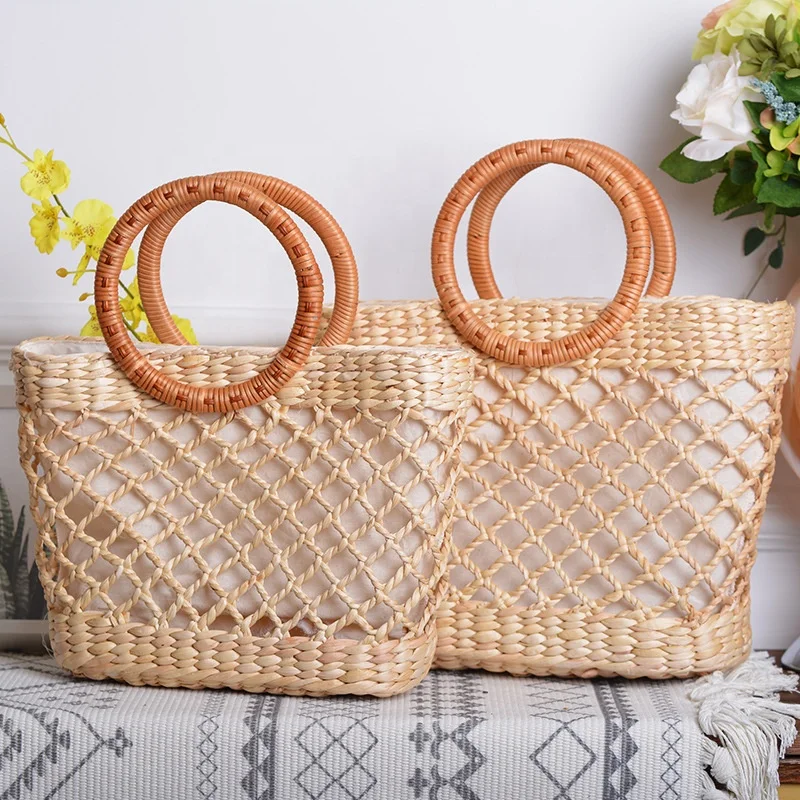 

Hand Weave Designer Hollow Pattern Resort Women Lady Basket Bag with Round Rattan Handle