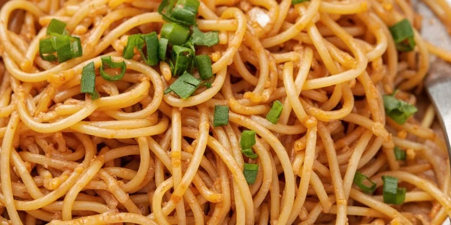 Tamarind paste added to spicy noodles