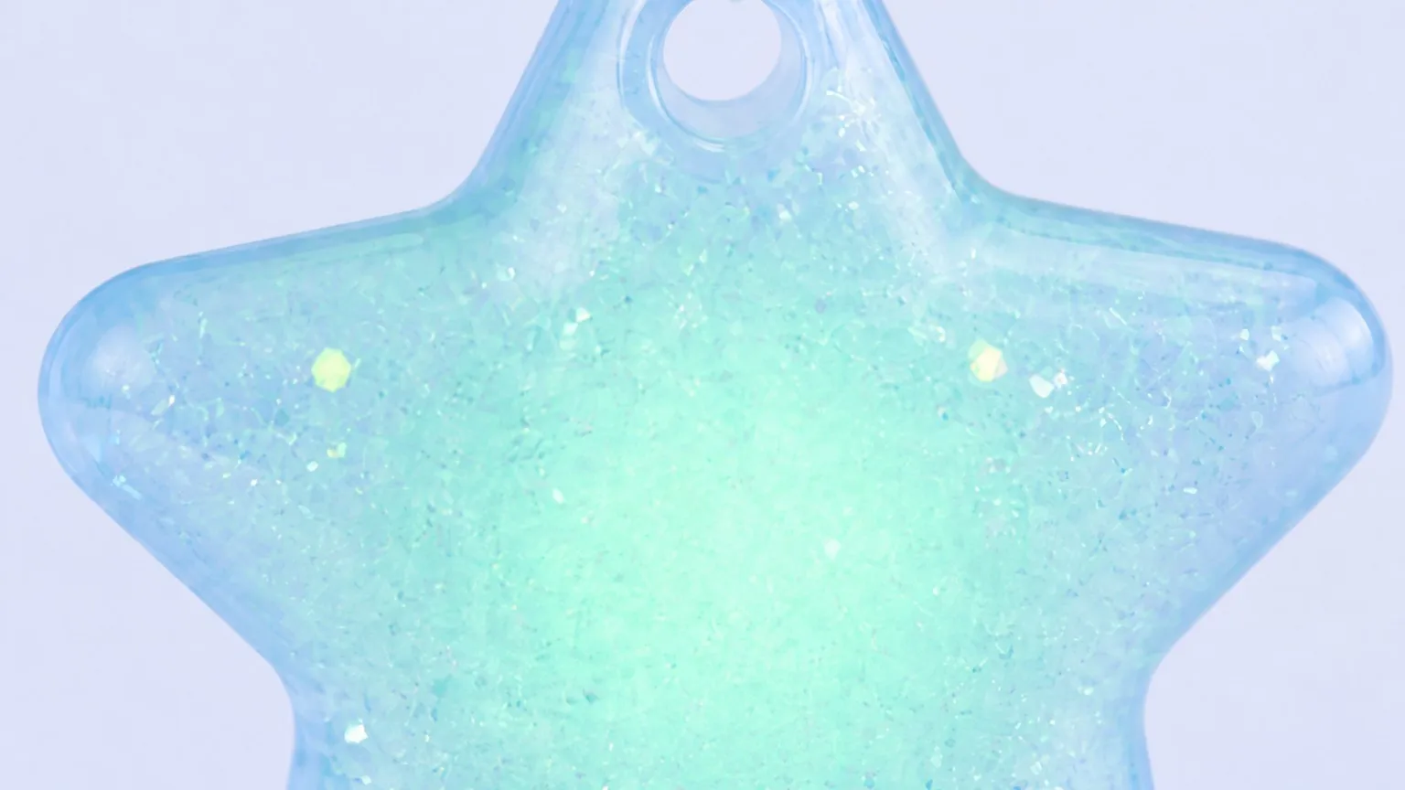 Macro close-up of the star keychain material and glitter