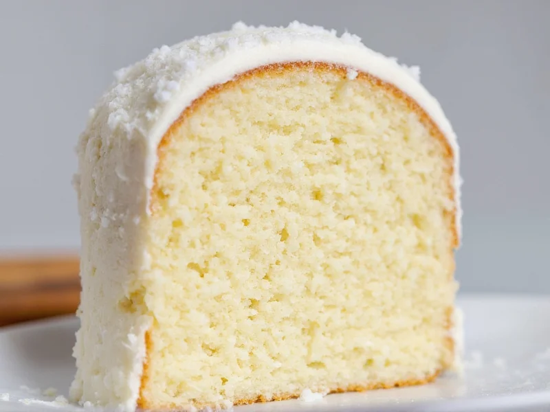 Sliced homemade white cake showing perfect fluffy crumb structure