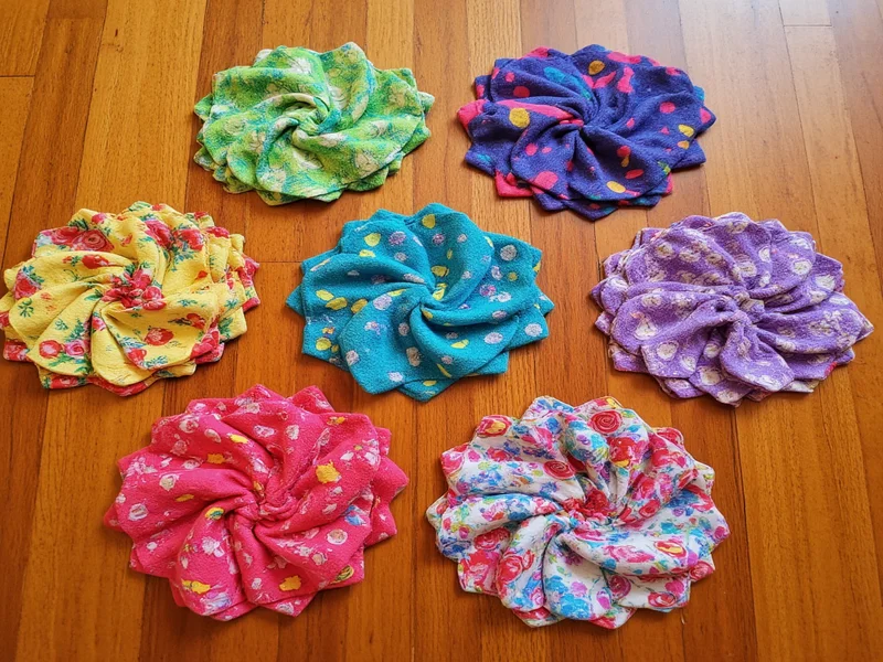 Colorful fabric scrap coasters on wooden table