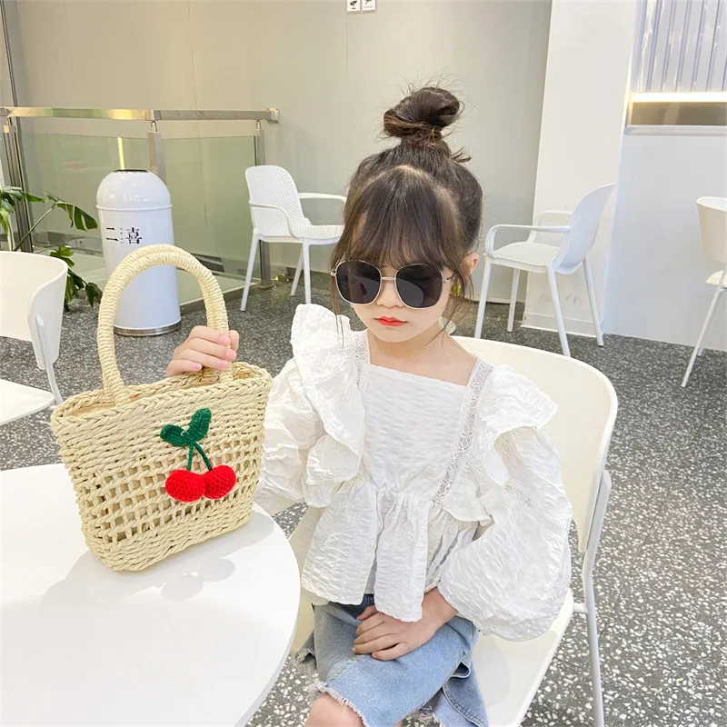 

Ins summer new Korean version cherry bow straw bucket children's hand basket bag women's bag tide