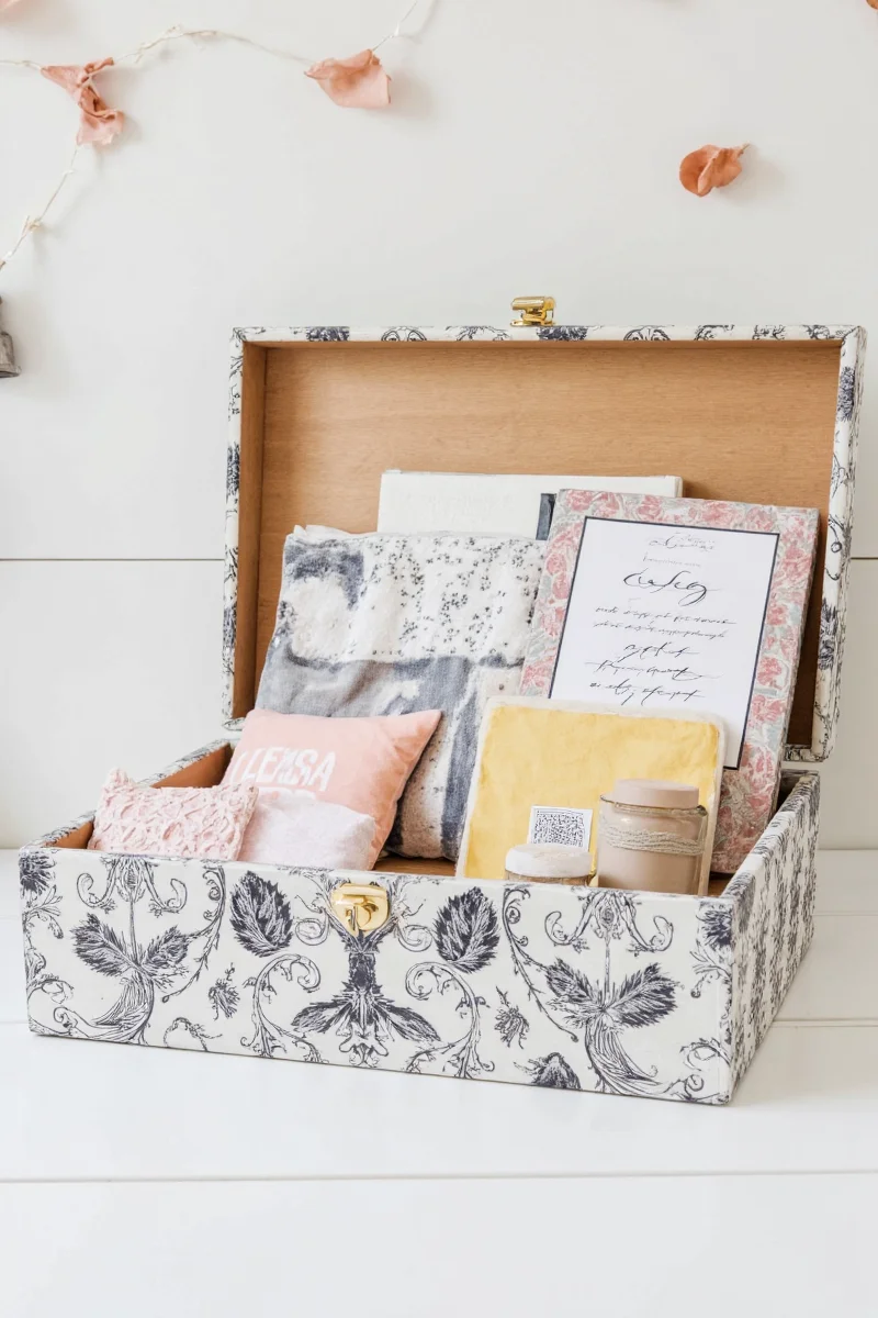 Decorative legacy box filled with books and stuffed toys