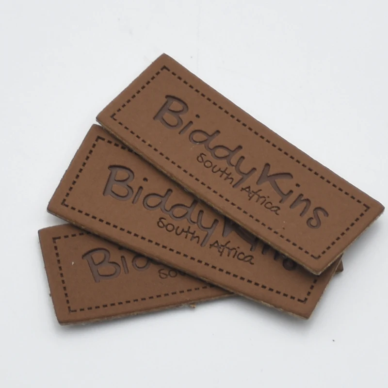 

Premium brown Jeans Clothing Patch Custom Debossed Brand Logo Pu Leather Label Tag With Stitches, Customized