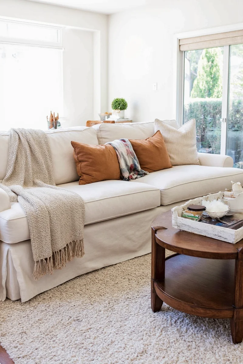 Different creative uses of a living room blanket beyond the couch