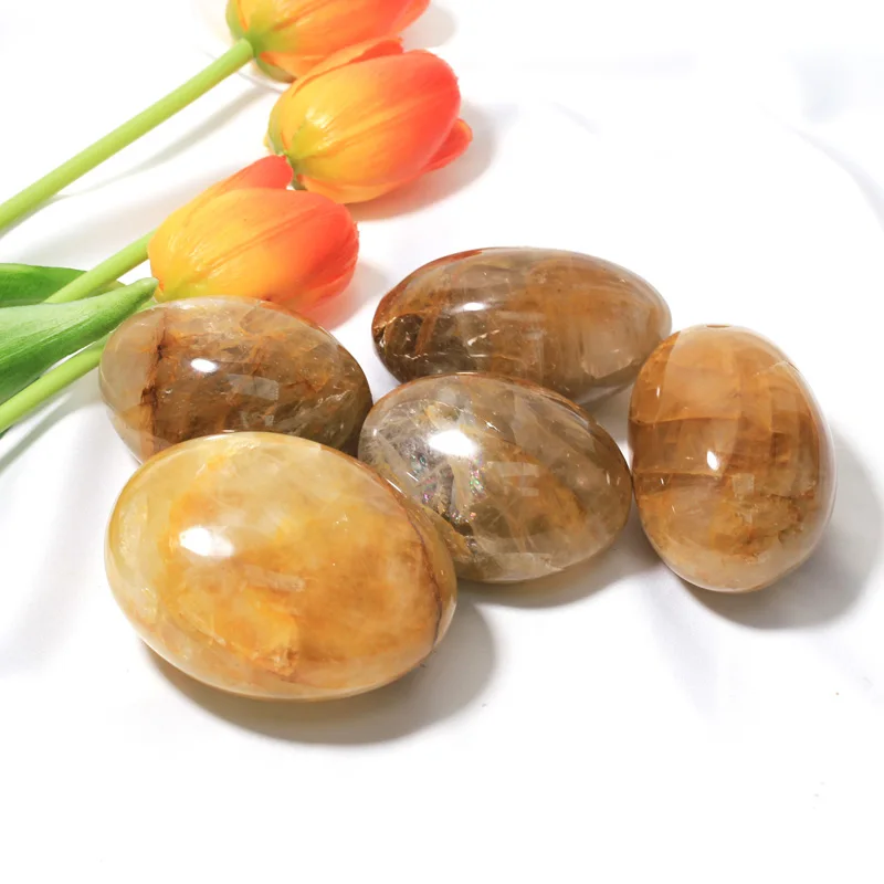 

Wholesale Natural Palm Healing Stone Crystal Palm Golden Healer Tumbled For Decoration