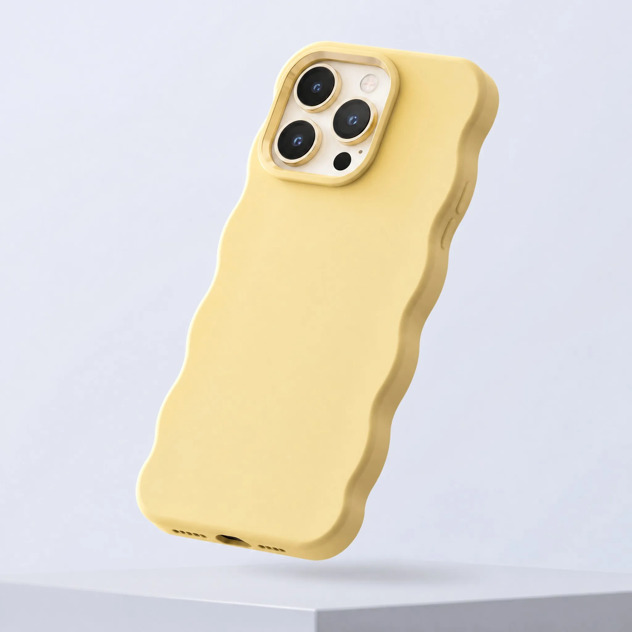 Butter Yellow Wavy Scalloped Liquid Silicone Phone Case Floating 3/4 Perspective View with Metallic Camera Ring