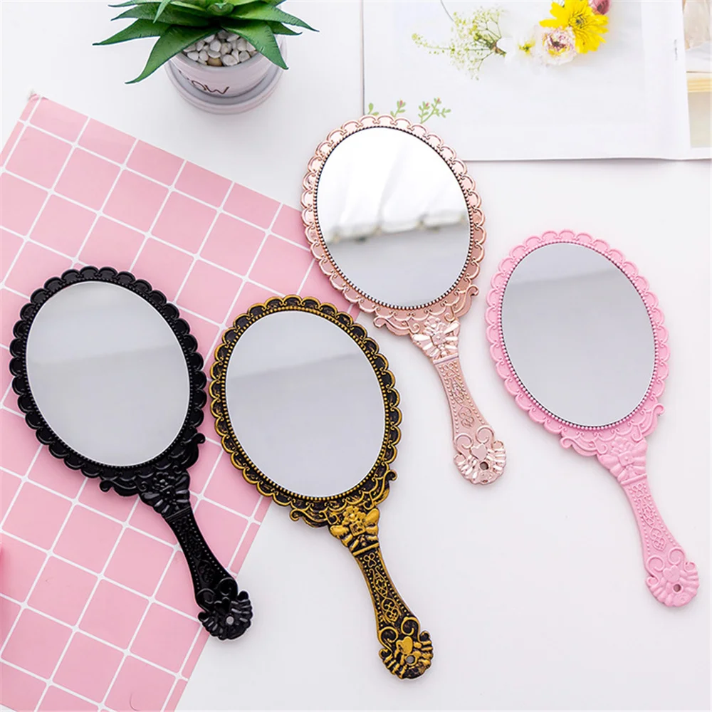 

Honey phoebe creative retro pattern handle makeup mirror small retro cute exquisite hand held artistic 2021 round makeup mirror, 4 colors