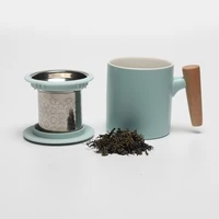 

Fashion porcelain mug with tea infuser and metal lid with wood handle different color available