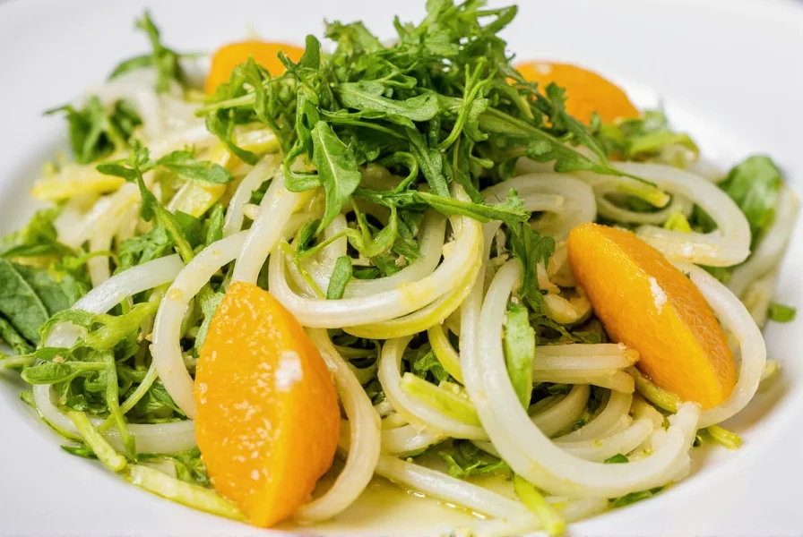 Fresh fennel salad with orange slices, arugula, and lemon dressing