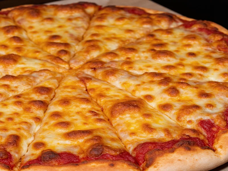 Golden brown pizza crust with bubbling cheese