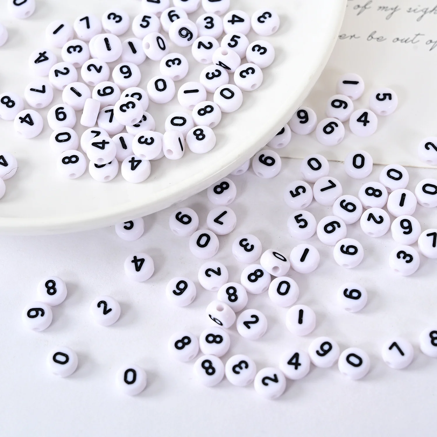 

DS Wholesale 4*7mm Round Arabic numerals beads White beads and black numbers 500 gram per pack