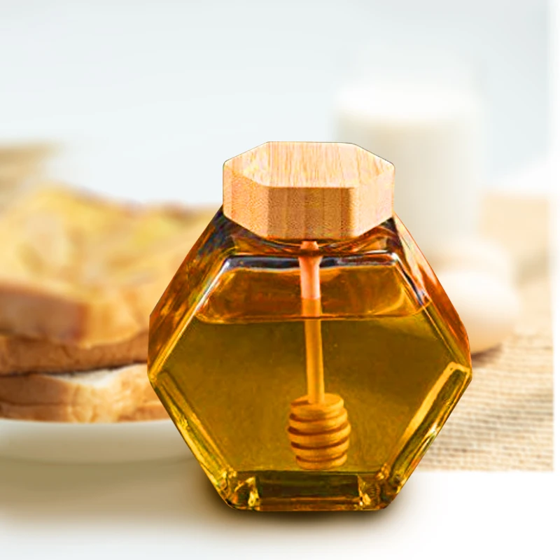 

Hot sale 220ml 380ml honey jar glass hexagon food storage container bottle with wood cap and honey dipper