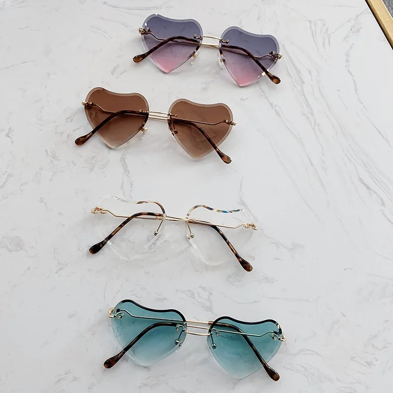 

2021 new latest fashion heart shaped child sun glasses girls rimless baby glasses creative sunglasses, As the pictures show