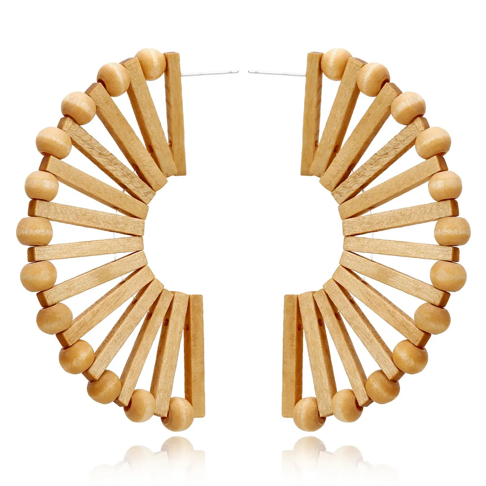 

The new Bohemian folk style wooden hollow out fan earrings