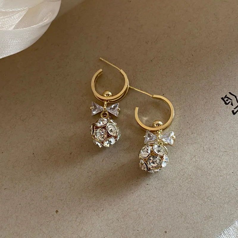 

Korean Stylish S925 Sterling Silver CZ Zirconia Bowknot Earrings Shiny Rhinestone Crystal Bowknot Pendant Earrings for Women