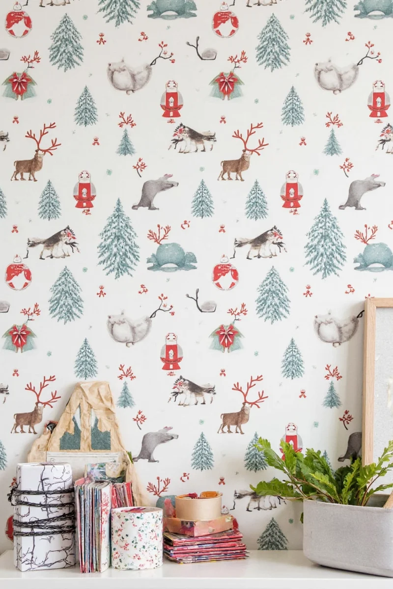 A living room decorated with festive wrapping paper wallpaper.
