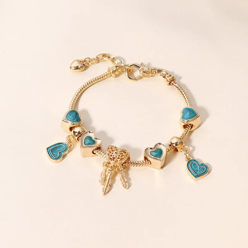 

European Hotsale Beaded Blue Oil Drip Heart Charm Bracelets Women Gold Plating Hollow Heart Feather Dreamcatcher Charm Bracelet