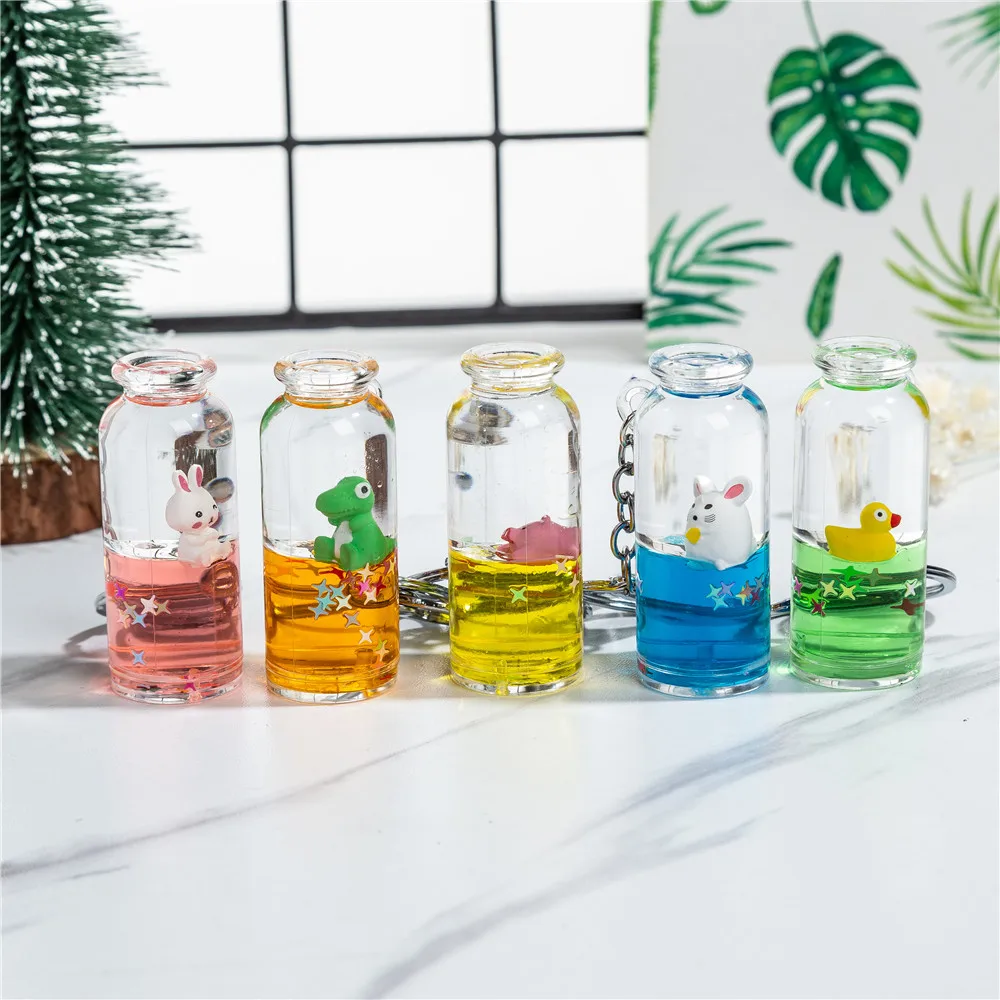 

Cheap Bottle Shape Liquid Customized Promotion Keyring Acrylic 3D Floating Flower Glitter Aqua Keychain