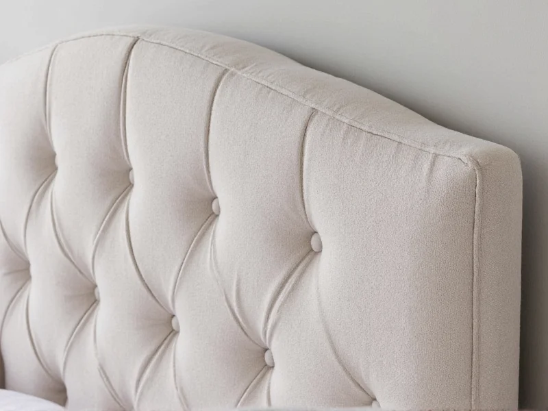 Close-up of tufted headboard detail with diamond pattern