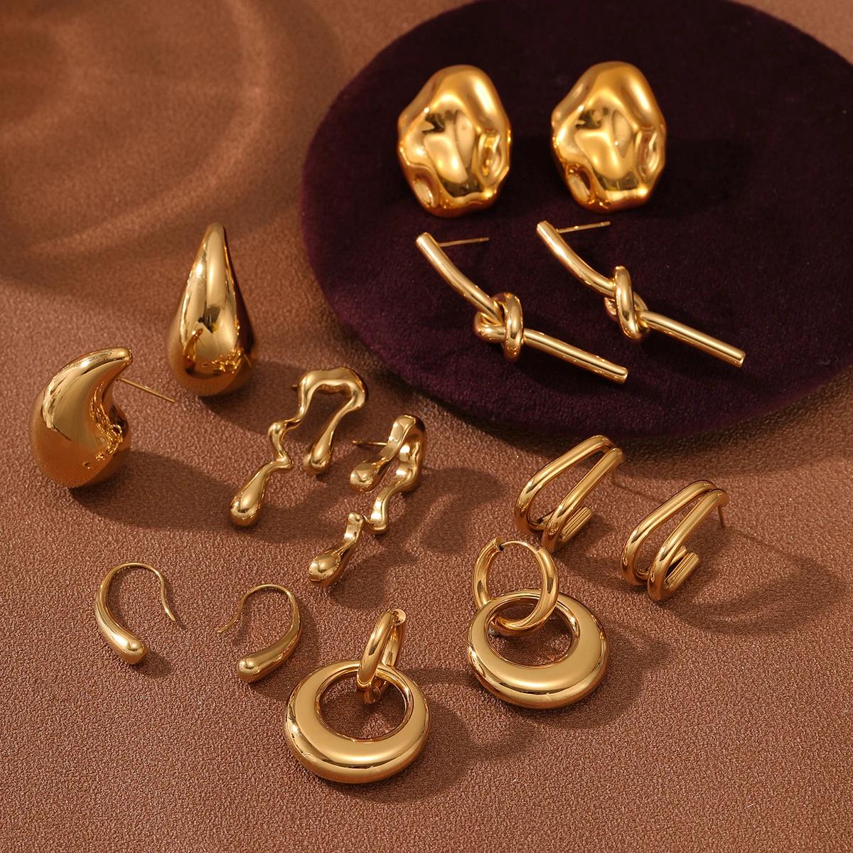 

Yiwu nimai bulk wholesale earrings titanium steel pvd gold plated cc hoop 316l stainless steel jewelry wholesale