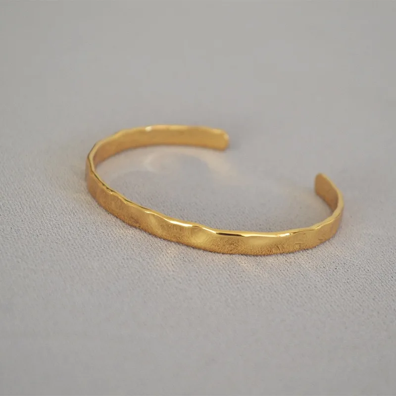 

Atelier Studio original design Korean simplistic vintage hammered texture brass plated 18K gold open adjustable bangle bracelet