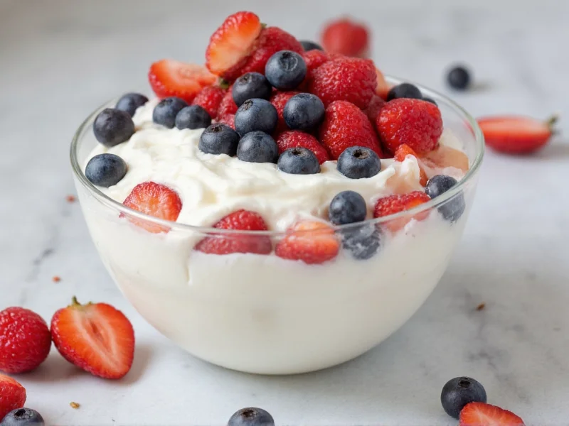 Homemade yogurt with fresh berries in glass bowl