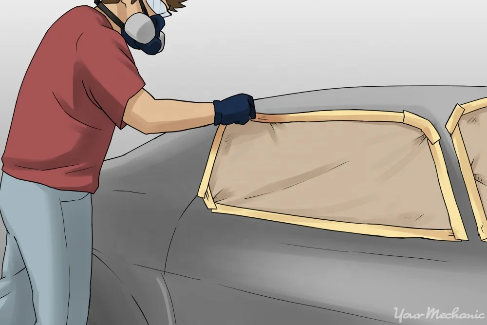 3-How to Remove Paint from Car Parts-Man standing next to car prepped for paint removal.jpg