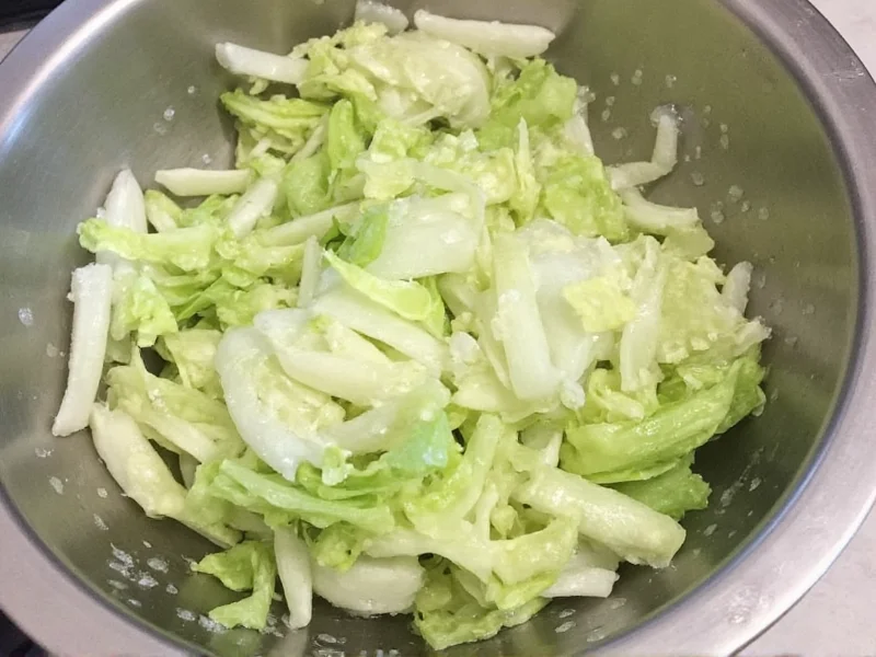 Rinsing salted napa cabbage in colander
