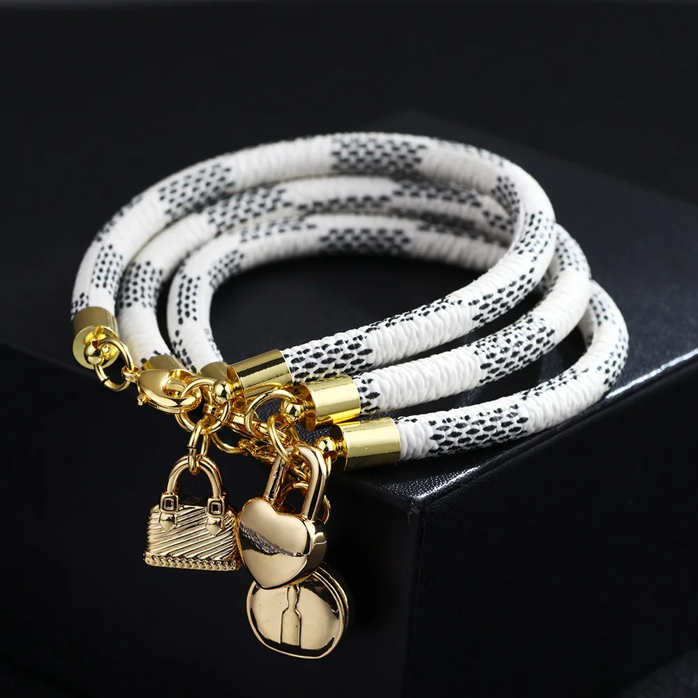 

2021 New Pu Striped Hot Style Copper Buckle Plated Gold Round Lock Leather Bracelet