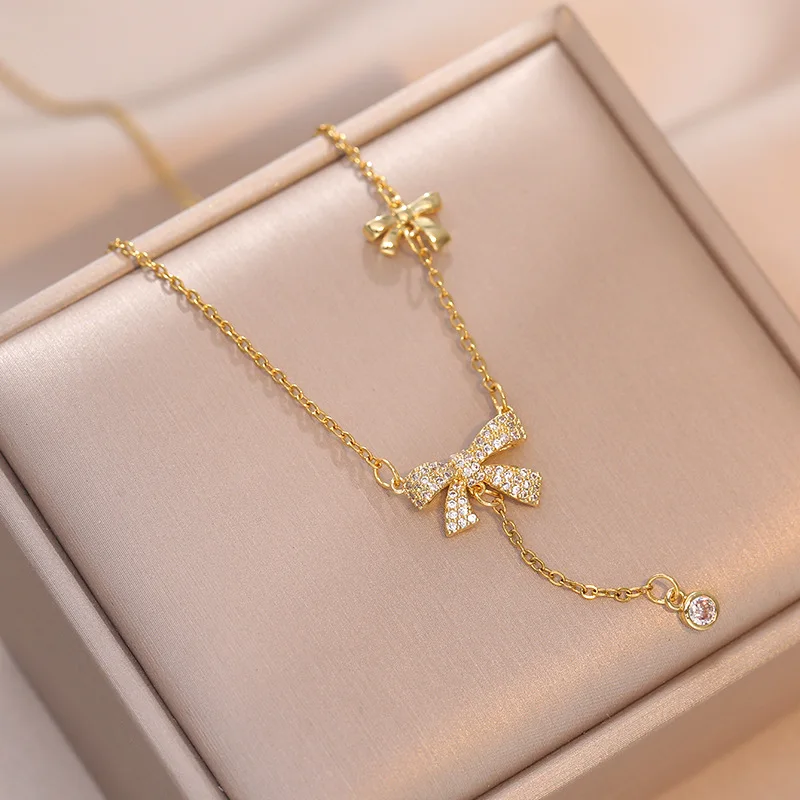 

Cubic Zircon Stainless Steel Pendant Necklace Gold Plated Double Bow Tassel Necklace For Girls