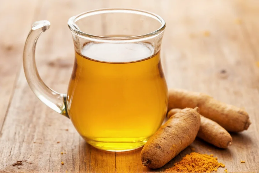 Turmeric tea preparation showing fresh turmeric root, black pepper, and coconut oil ingredients
