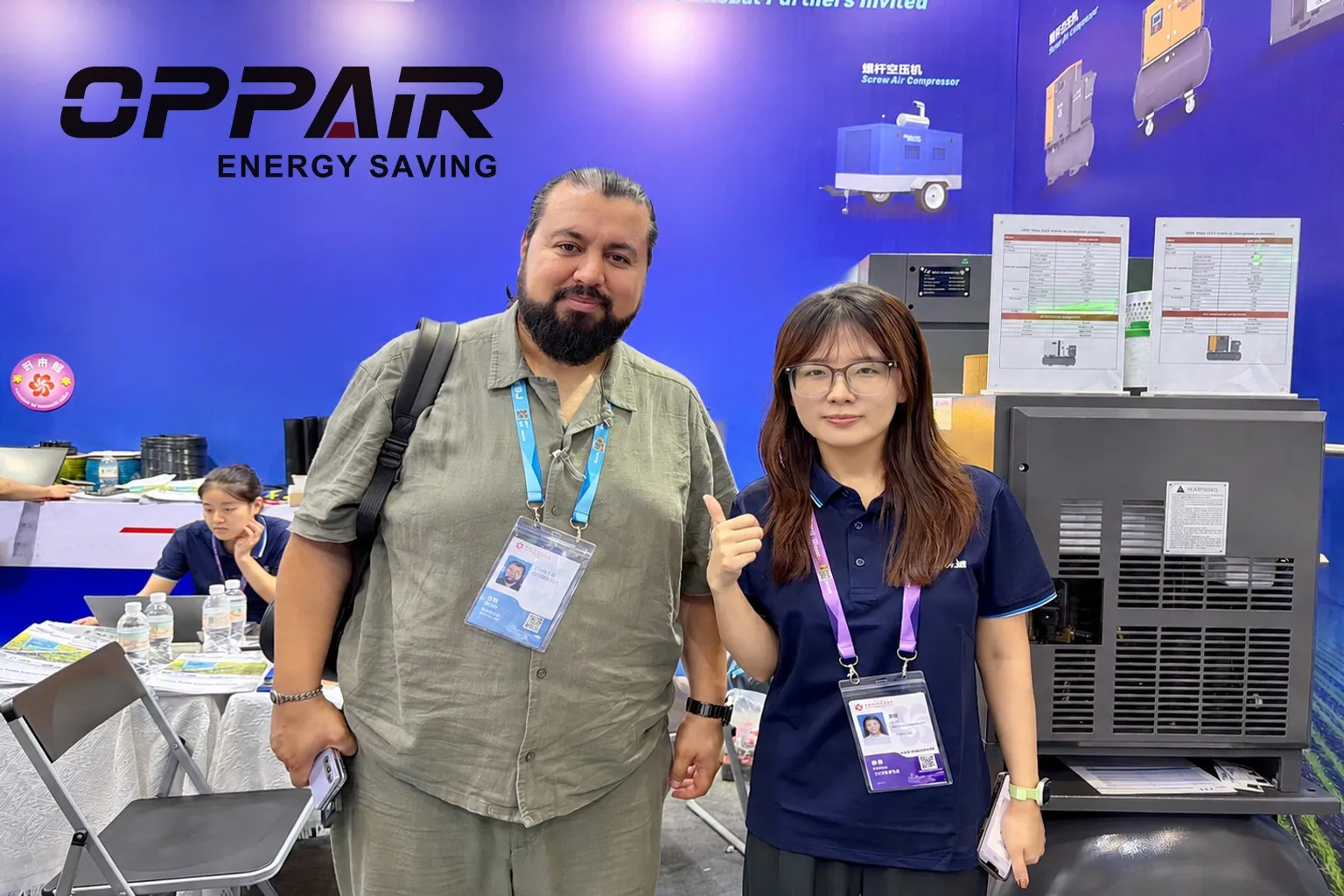 OPPAIR Representative Welcoming International Business Partner at Booth