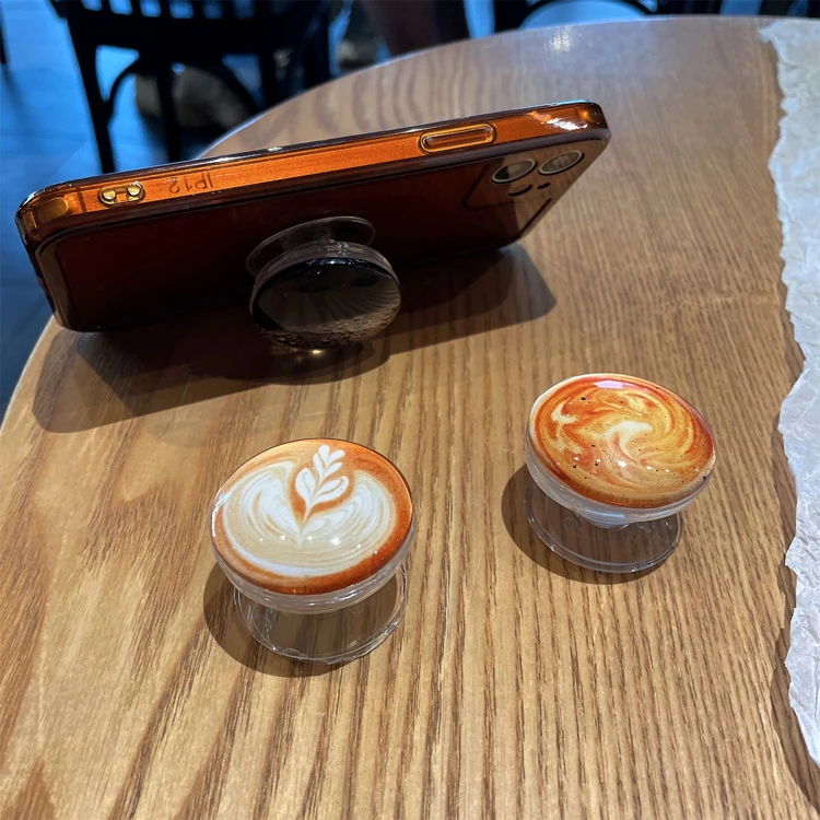

Factory Wholesale 3D Coffee Design ABS Epoxy Phone Holder Socket Custom Logo Foldable Acrylic Airbag Phone Desk Stand