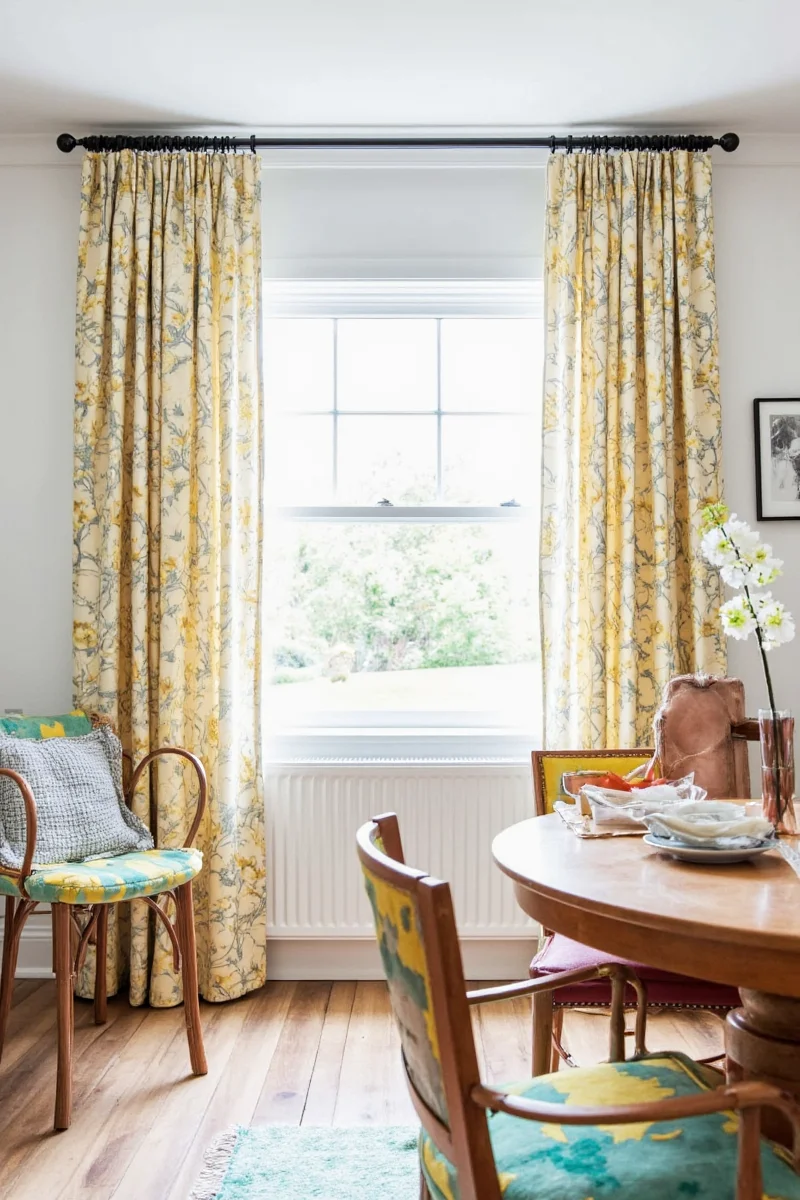 Dining room with soft light filtering through curtains